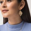 Heera Earrings. A pair of golden brass diamond shaped drop earrings with a rough textured effect. These earrings are made from waste metal used in other pieces of jewellery. An eco-friendly and contemporary product.