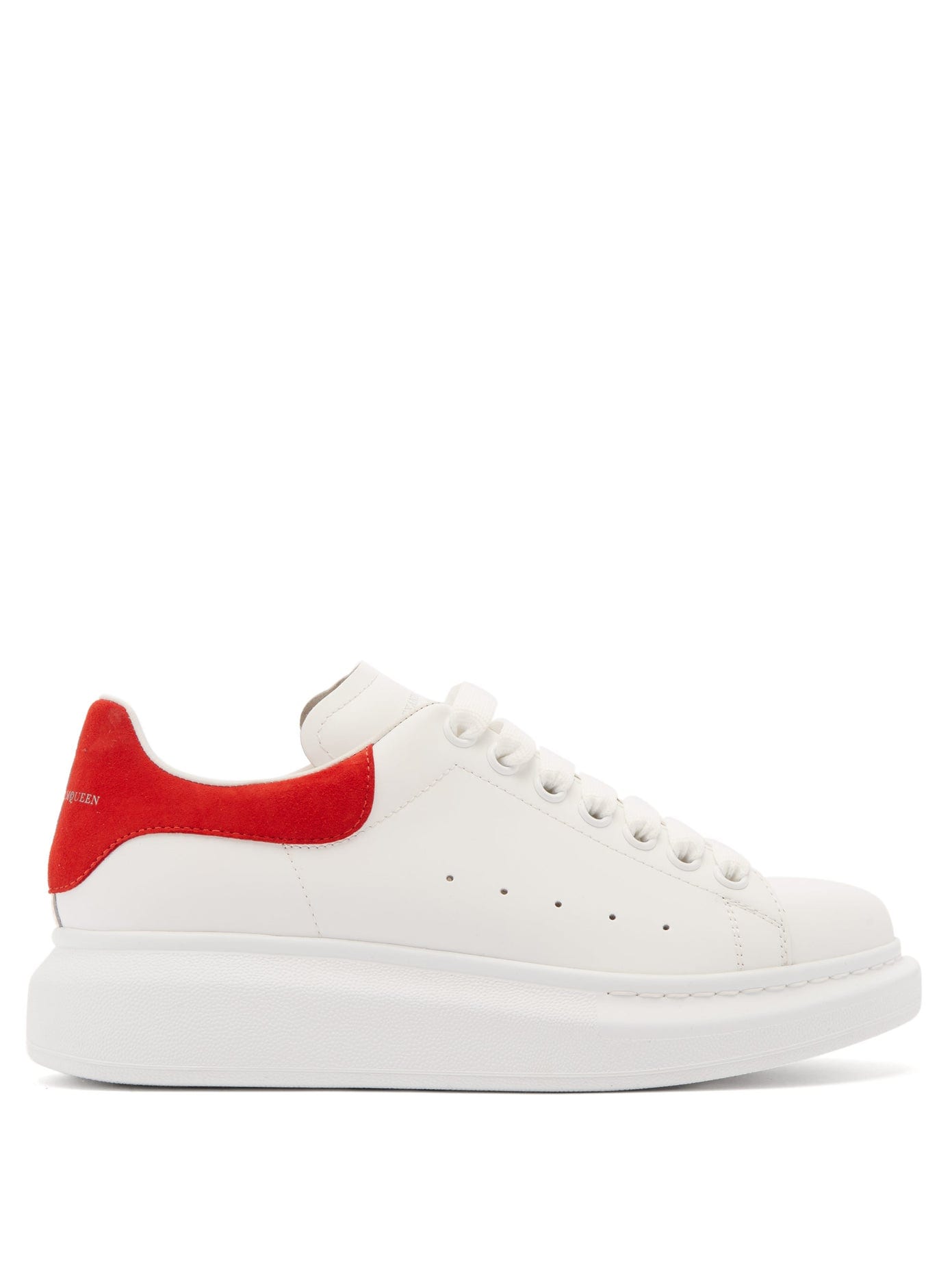 white leather platform sneakers with red heel tab
